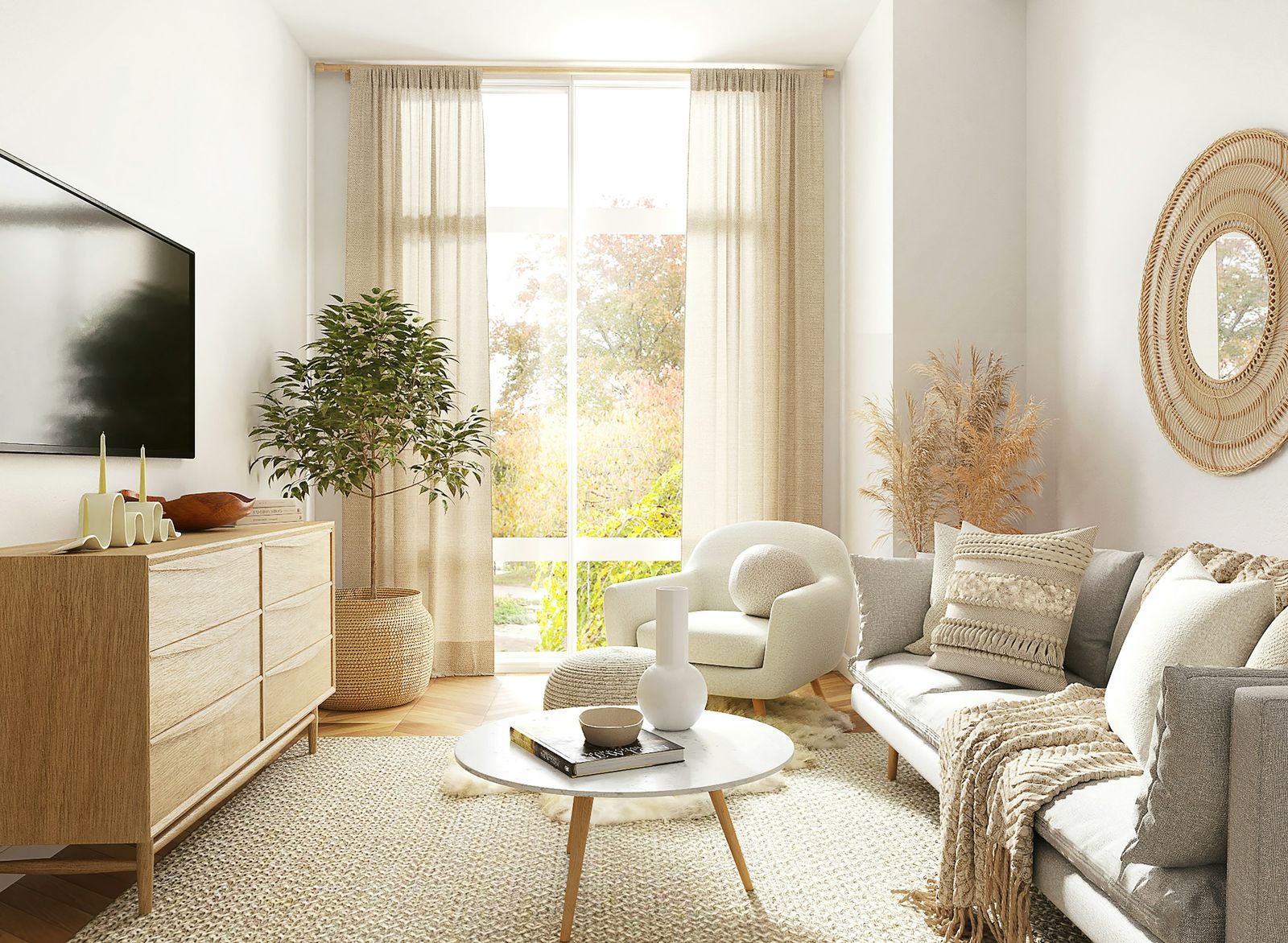 Bright living room with a cream sofa, cushions, a boucle armchair and a round coffee table